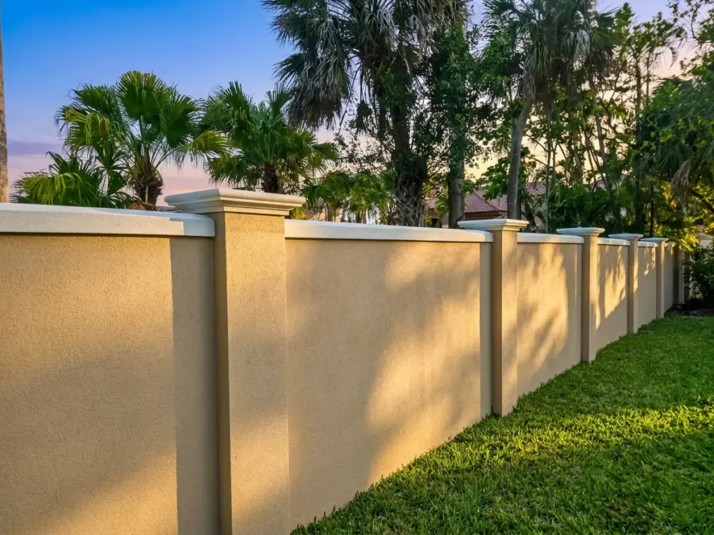 Finished installation of outdoor decorative fence panels glowing at sunset, delivering the premium quietness of acoustic wall panels for living room spaces right to the exterior garden.
